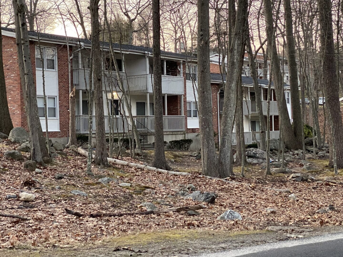 A row of houses on the side of a hill.