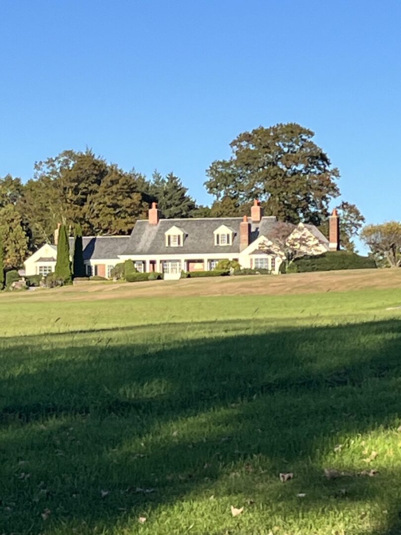 A large house with many windows and trees