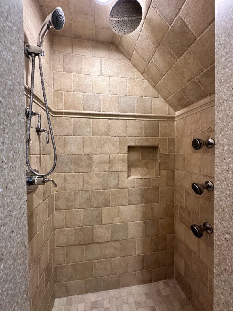 A bathroom with tiled walls and floors.