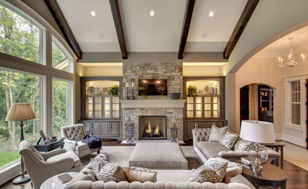 A living room with couches and chairs, fireplace.
